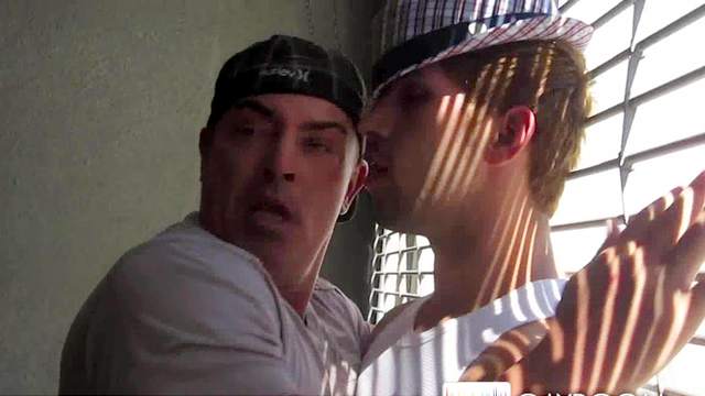 Two alluring dudes is kissing in their lips