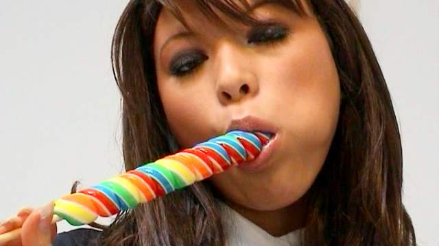Curly brunette Natalia Forrest is sucking tasty candy