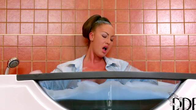 Alluring cutie such as Emma Butt, is taking bath clothed