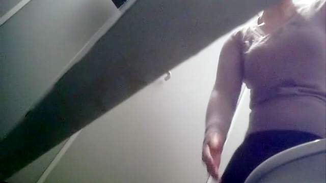 Toilet film of amazing pissing babe showing her ass