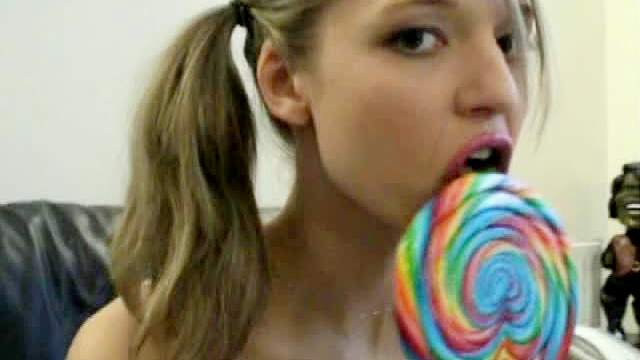 Pigtailed lollipop sucker with toy