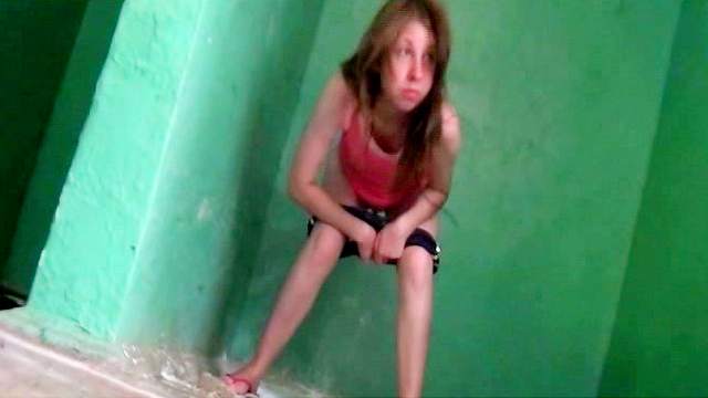 Sweet babe is pissing in the abandoned building