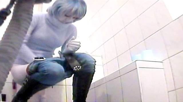 Hardcore blonde is pissing in the public toilet