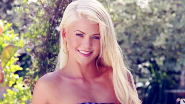 Alluring blonde Annette White is smiling in the camera