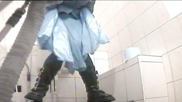 Innocent brunette is peeing on the camera in close up