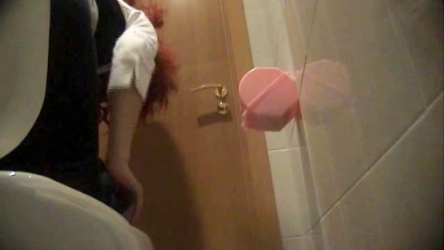 Hottest redhead model is peeing in the toilet