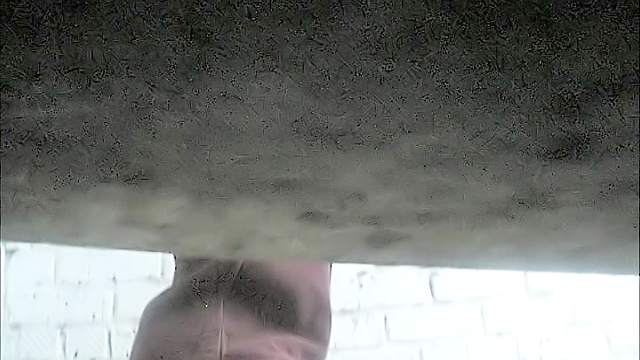 Cute babe is peeing with pleasure on the camera lenses