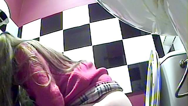 Slender blonde with nice stockings is peeing