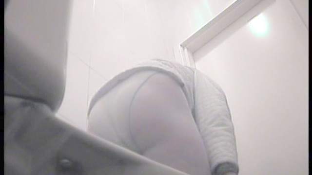 Sweet busty babe is peeing and wiping her puss