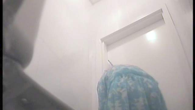 Hot busty one is peeing in the toilet