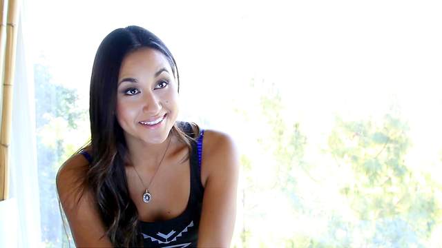 Sensual tanned babe Jeannie Santiago is getting naked on the video