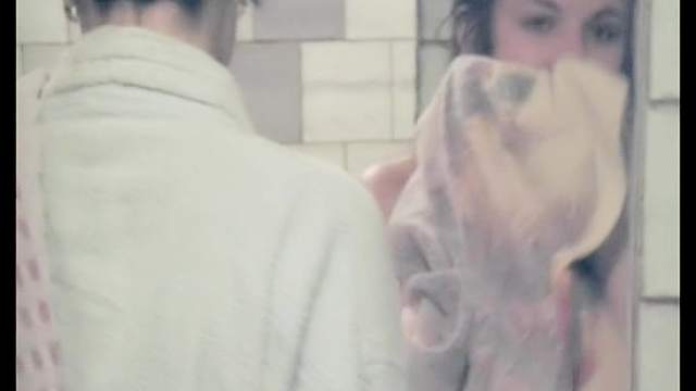 Slender babe is taking a voyeur shower